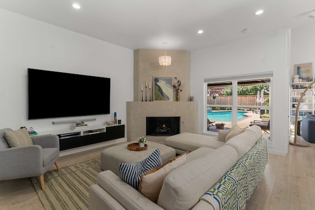 4005 Province Dr, Carrollton, TX 75007 - living room with light wood-style flooring, recessed lighting, and a fireplace