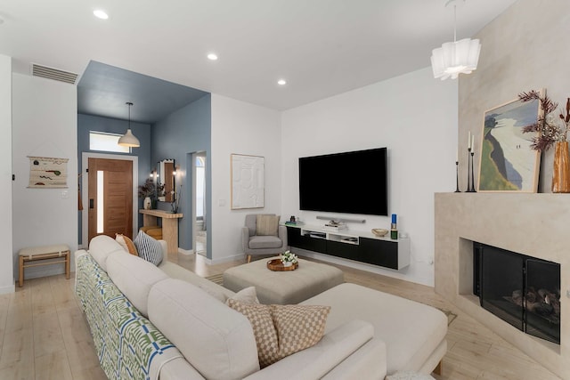 4005 Province Dr, Carrollton, TX 75007 - living area with recessed lighting, light wood-style floors, a high end fireplace, and baseboards