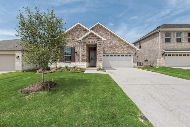 3404 Riverlawn Dr, Anna, TX 75409 - view of front facade with driveway, a front lawn, brick siding, central AC, and a garage