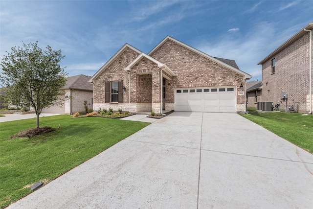 3404 Riverlawn Dr, Anna, TX 75409 - view of front of home featuring brick siding, an attached garage, central AC unit, concrete driveway, and a front lawn