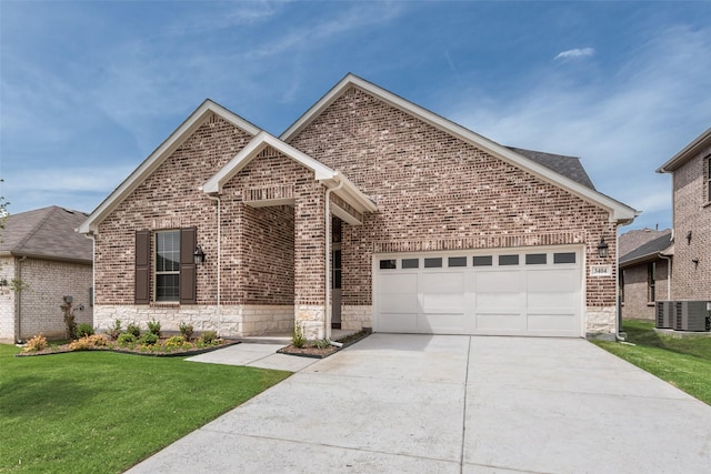 3404 Riverlawn Dr, Anna, TX 75409 - view of front facade featuring cooling unit, brick siding, concrete driveway, and a front lawn