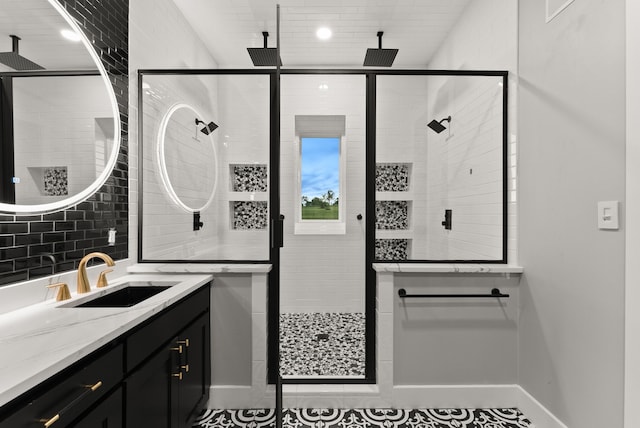 1210 Berger Rd, Temple, TX 76501 - full bath with vanity, a shower stall, baseboards, and tile patterned floors