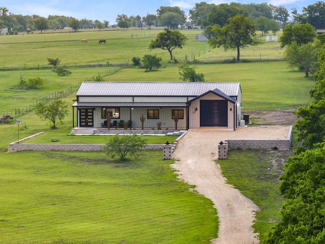1210 Berger Rd, Temple, TX 76501 - view of front facade with a front lawn, metal roof, dirt driveway, and covered porch