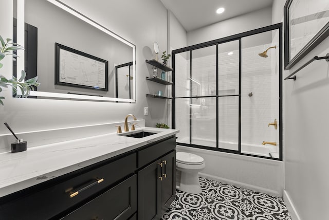 1210 Berger Rd, Temple, TX 76501 - bathroom with toilet, vanity, combined bath / shower with glass door, and tile patterned flooring