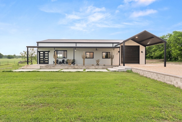 1210 Berger Rd, Temple, TX 76501 - view of front facade featuring a front lawn, dirt driveway, metal roof, and an outbuilding