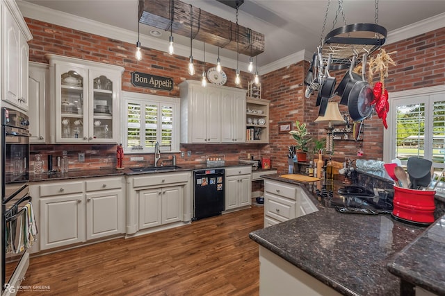 1171 Wemple Rd, Bossier City, LA 71111 - kitchen with black appliances, brick wall, a sink, ornamental molding, and wood finished floors