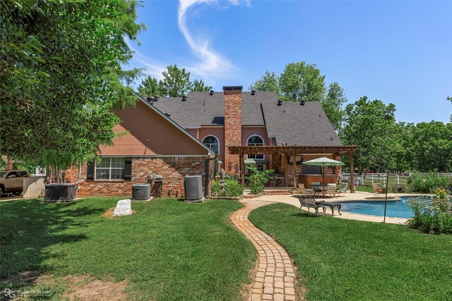 1171 Wemple Rd, Bossier City, LA 71111 - back of property featuring a chimney, a patio area, brick siding, and central air condition unit