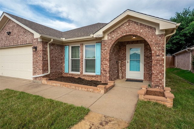 12200 Rolling Ridge Dr, Fort Worth, TX 76028 - entrance to property featuring brick siding, an attached garage, roof with shingles, and concrete driveway