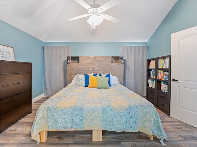 12200 Rolling Ridge Dr, Fort Worth, TX 76028 - bedroom with vaulted ceiling, wood finished floors, and a ceiling fan