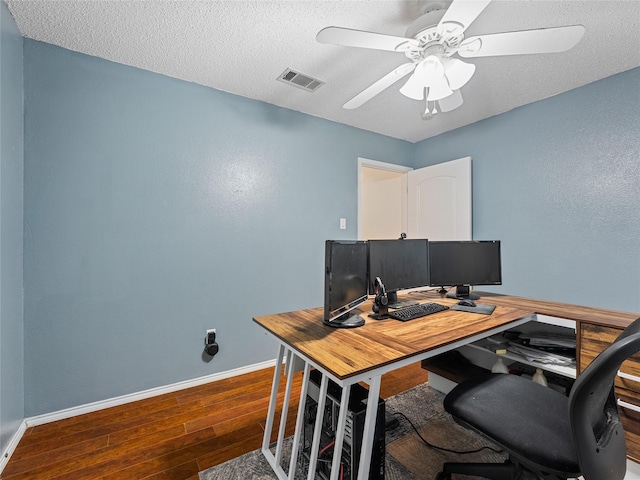 12200 Rolling Ridge Dr, Fort Worth, TX 76028 - office area with wood finished floors, baseboards, ceiling fan, and a textured ceiling