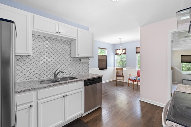 1701 Lawther Dr, River Oaks, TX 76114 - kitchen featuring stainless steel dishwasher, a sink, white cabinets, tasteful backsplash, and dark wood-style floors