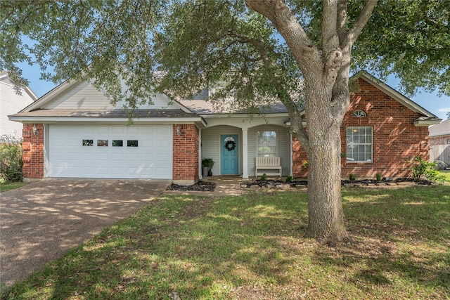 10161 Aragon Dr, Waco, TX 76708 - view of front of home with concrete driveway, brick siding, an attached garage, and a front yard