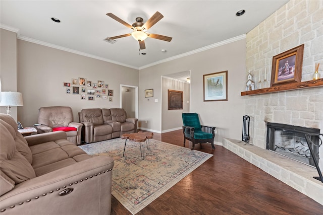10161 Aragon Dr, Waco, TX 76708 - living area featuring ornamental molding, a ceiling fan, dark wood finished floors, baseboards, and a fireplace