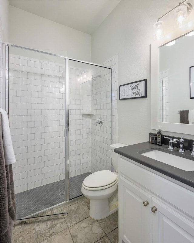 3812 Ironbark Way, Mckinney, TX 75071 - full bathroom featuring vanity, a stall shower, toilet, and tile patterned floors
