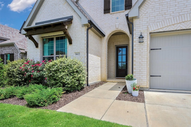 3812 Ironbark Way, Mckinney, TX 75071 - doorway to property featuring brick siding and an attached garage