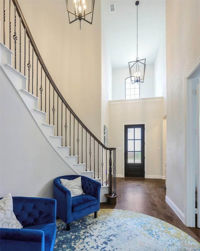 3812 Ironbark Way, Mckinney, TX 75071 - foyer with a chandelier, a high ceiling, wood finished floors, stairs, and baseboards