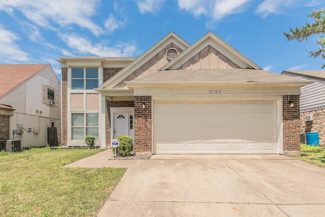 3733 River Birch Rd, Fort Worth, TX 76137 - view of front facade featuring brick siding, concrete driveway, a front yard, and board and batten siding