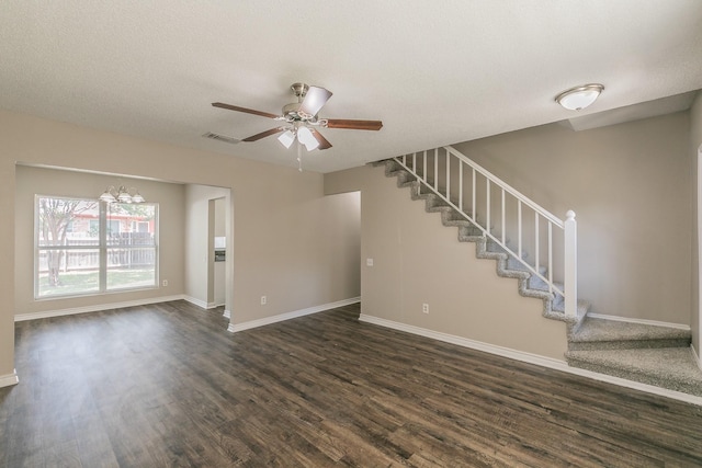 3733 River Birch Rd, Fort Worth, TX 76137 - unfurnished living room with dark wood finished floors, stairway, ceiling fan, baseboards, and a chandelier