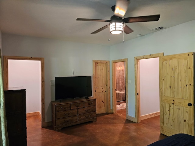 437 County Road 3190, Winnsboro, TX 75494 - bedroom featuring concrete floors, ceiling fan, baseboards, and connected bathroom