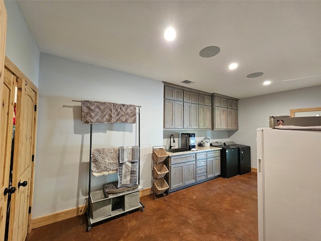 437 County Road 3190, Winnsboro, TX 75494 - kitchen featuring freestanding refrigerator, gray cabinetry, finished concrete floors, recessed lighting, and a sink