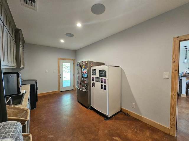 437 County Road 3190, Winnsboro, TX 75494 - kitchen featuring freestanding refrigerator, concrete flooring, baseboards, and recessed lighting