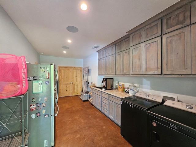 437 County Road 3190, Winnsboro, TX 75494 - kitchen featuring separate washer and dryer, freestanding refrigerator, concrete flooring, recessed lighting, and light countertops