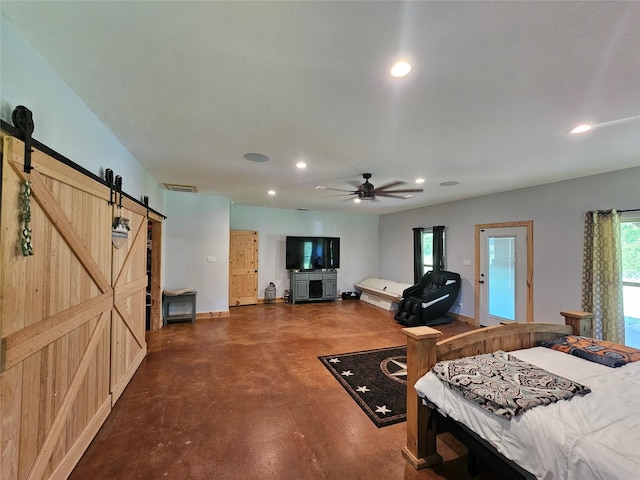 437 County Road 3190, Winnsboro, TX 75494 - bedroom featuring a barn door, recessed lighting, finished concrete flooring, and baseboards