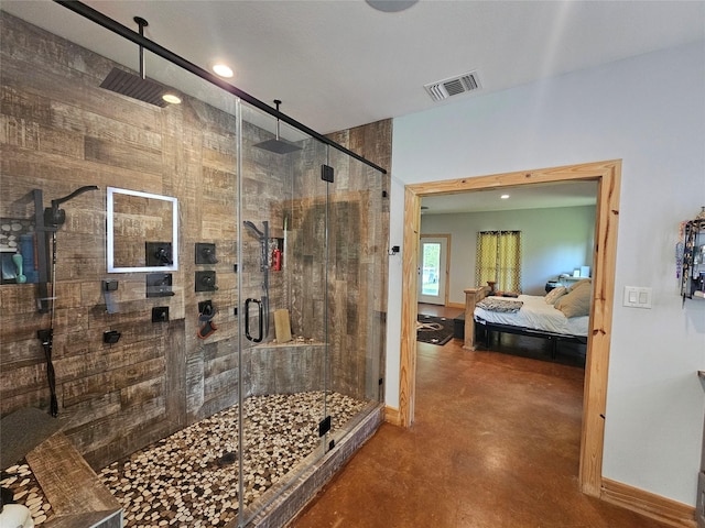 437 County Road 3190, Winnsboro, TX 75494 - ensuite bathroom featuring finished concrete flooring, a shower stall, baseboards, and recessed lighting