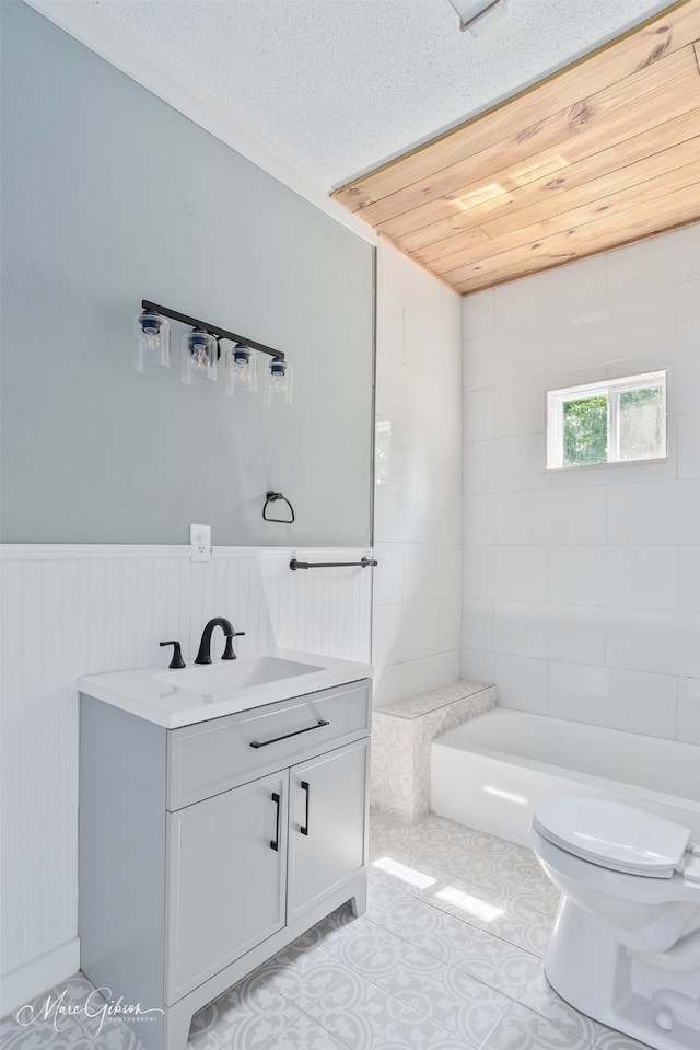 2383 Julia St, Bossier City, LA 71112 - full bathroom featuring a tub, toilet, vanity, tile patterned flooring, and a textured ceiling