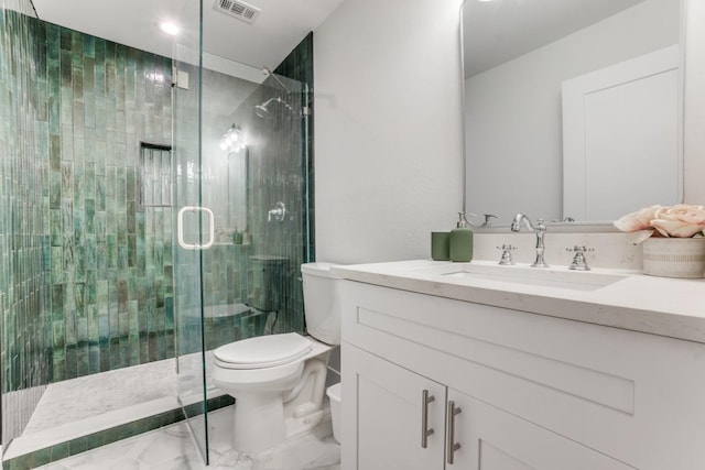 1614 Engle Ave, Dallas, TX 75224 - bathroom with marble finish floors, toilet, vanity, and a shower stall
