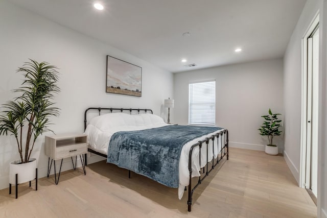 1614 Engle Ave, Dallas, TX 75224 - bedroom with light wood finished floors, recessed lighting, and baseboards