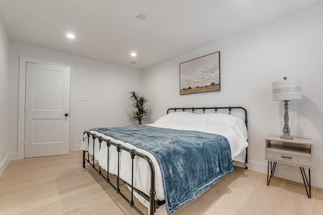 1614 Engle Ave, Dallas, TX 75224 - bedroom with wood finished floors, baseboards, and recessed lighting