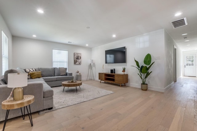 1614 Engle Ave, Dallas, TX 75224 - living area with light wood finished floors, healthy amount of natural light, recessed lighting, and baseboards