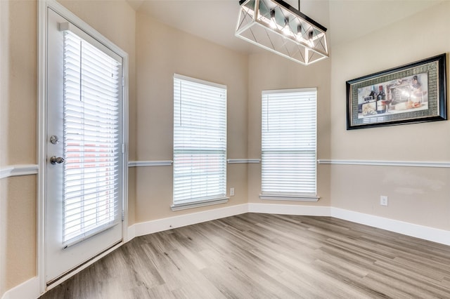 2828 Pino, Grand Prairie, TX 75054 - unfurnished dining area with wood finished floors