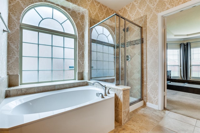 2828 Pino, Grand Prairie, TX 75054 - bathroom featuring wallpapered walls, a garden tub, and a shower stall