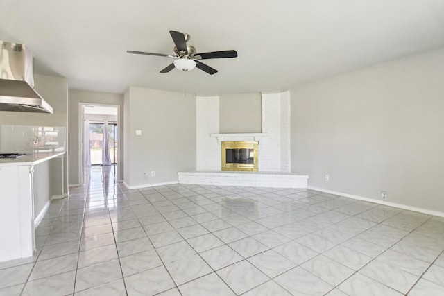 5001 N Colony Blvd, The Colony, TX 75056 - unfurnished living room with light tile patterned floors, ceiling fan, a brick fireplace, and baseboards