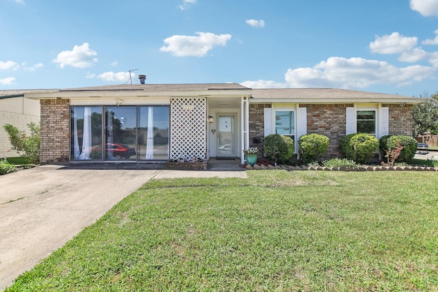 5001 N Colony Blvd, The Colony, TX 75056 - ranch-style home with brick siding and a front yard