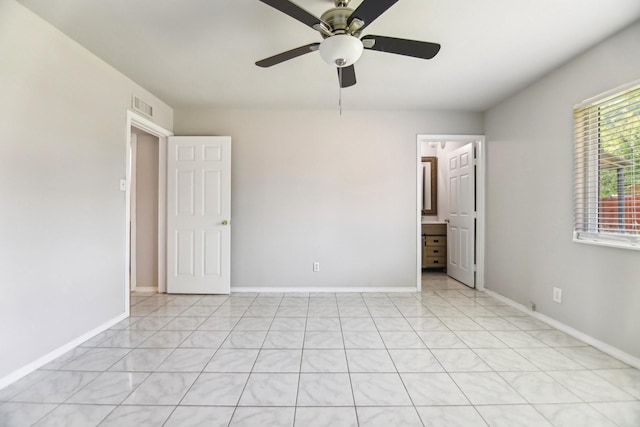 5001 N Colony Blvd, The Colony, TX 75056 - unfurnished bedroom featuring baseboards and a ceiling fan