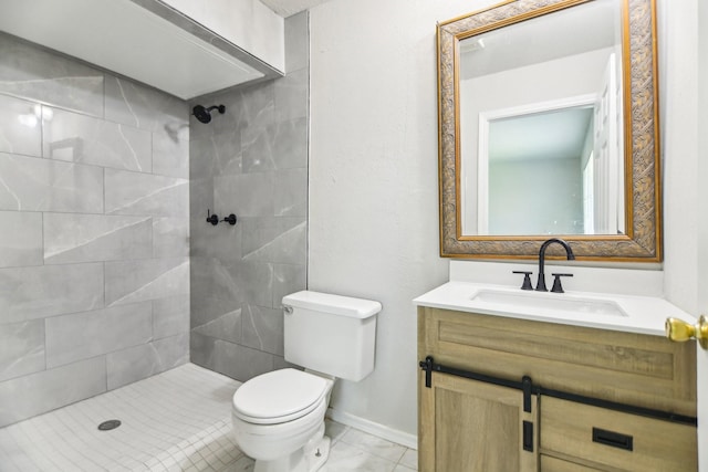 5001 N Colony Blvd, The Colony, TX 75056 - full bathroom with toilet, a tile shower, vanity, and baseboards