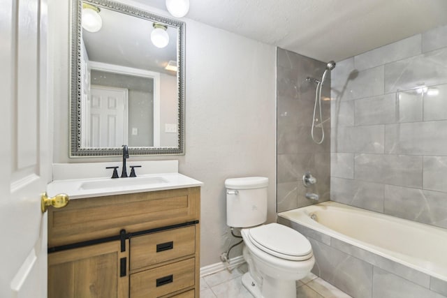 5001 N Colony Blvd, The Colony, TX 75056 - bathroom featuring toilet, tiled shower / bath combo, vanity, tile patterned flooring, and baseboards