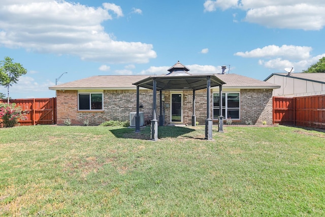 5001 N Colony Blvd, The Colony, TX 75056 - back of property featuring a gazebo, brick siding, and central AC
