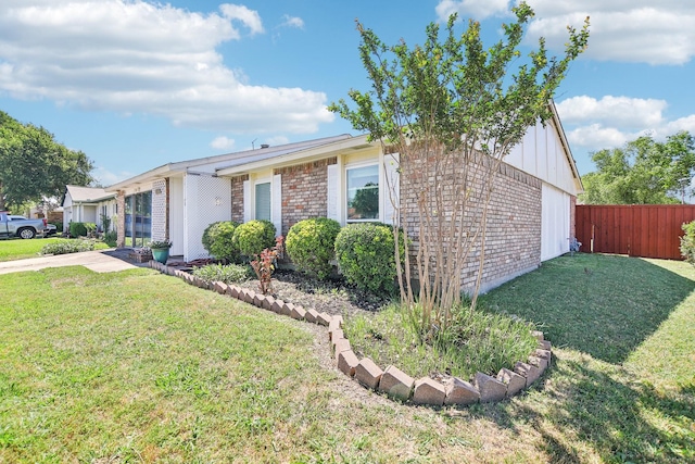 5001 N Colony Blvd, The Colony, TX 75056 - view of front of house with brick siding and board and batten siding