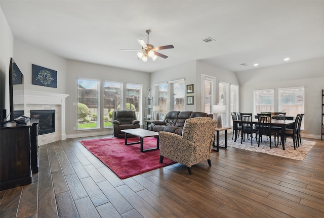 3904 Purple Sage Dr, Aubrey, TX 76227 - living area featuring ceiling fan, recessed lighting, dark wood-style flooring, a tile fireplace, and baseboards