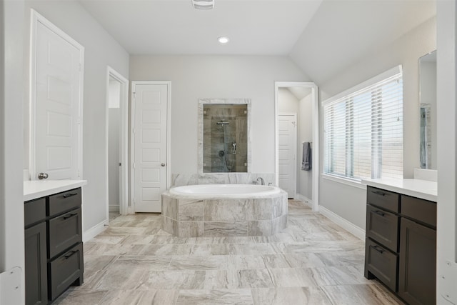 3904 Purple Sage Dr, Aubrey, TX 76227 - full bathroom with a tile shower, a garden tub, baseboards, vanity, and lofted ceiling