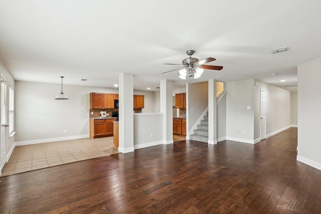 9897 Dartmouth Dr, Frisco, TX 75035 - unfurnished living room with ceiling fan, hardwood / wood-style floors, stairway, baseboards, and recessed lighting