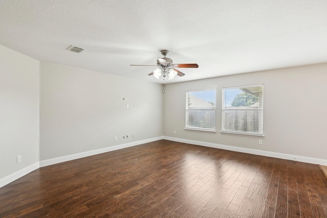 9897 Dartmouth Dr, Frisco, TX 75035 - spare room featuring ceiling fan, dark wood-style floors, and baseboards