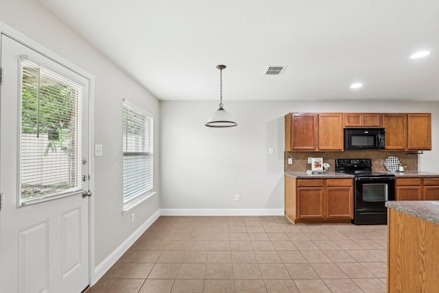 9897 Dartmouth Dr, Frisco, TX 75035 - kitchen with black appliances, tasteful backsplash, brown cabinets, baseboards, and recessed lighting