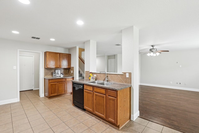 9897 Dartmouth Dr, Frisco, TX 75035 - kitchen with black dishwasher, a sink, light tile patterned floors, decorative backsplash, and recessed lighting