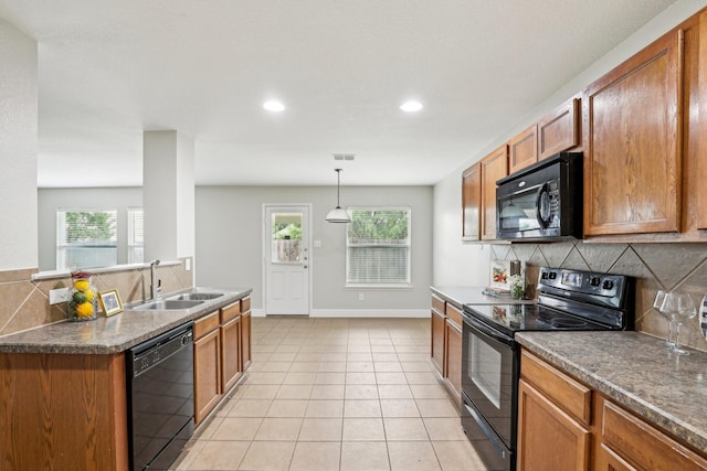 9897 Dartmouth Dr, Frisco, TX 75035 - kitchen with black appliances, a sink, decorative backsplash, brown cabinetry, and recessed lighting