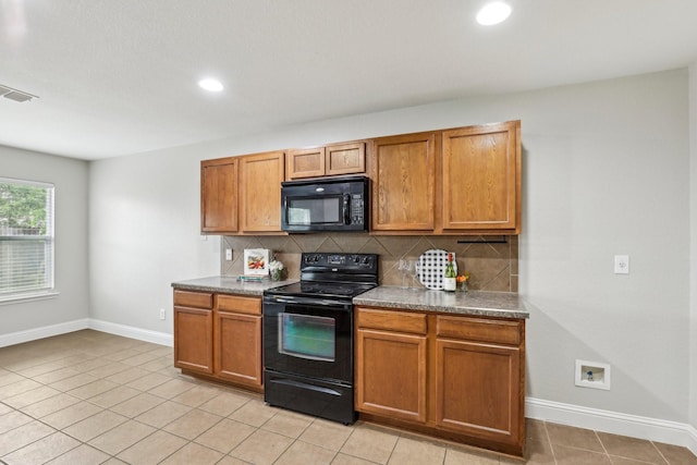 9897 Dartmouth Dr, Frisco, TX 75035 - kitchen featuring black appliances, baseboards, backsplash, brown cabinets, and recessed lighting